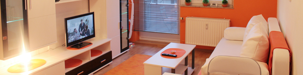 <h1>Apartment Little Orange</h1>
Die helle Möblierung mit Deko-Akzenten sorgt für erholungsames Ambiente in der Stadt.